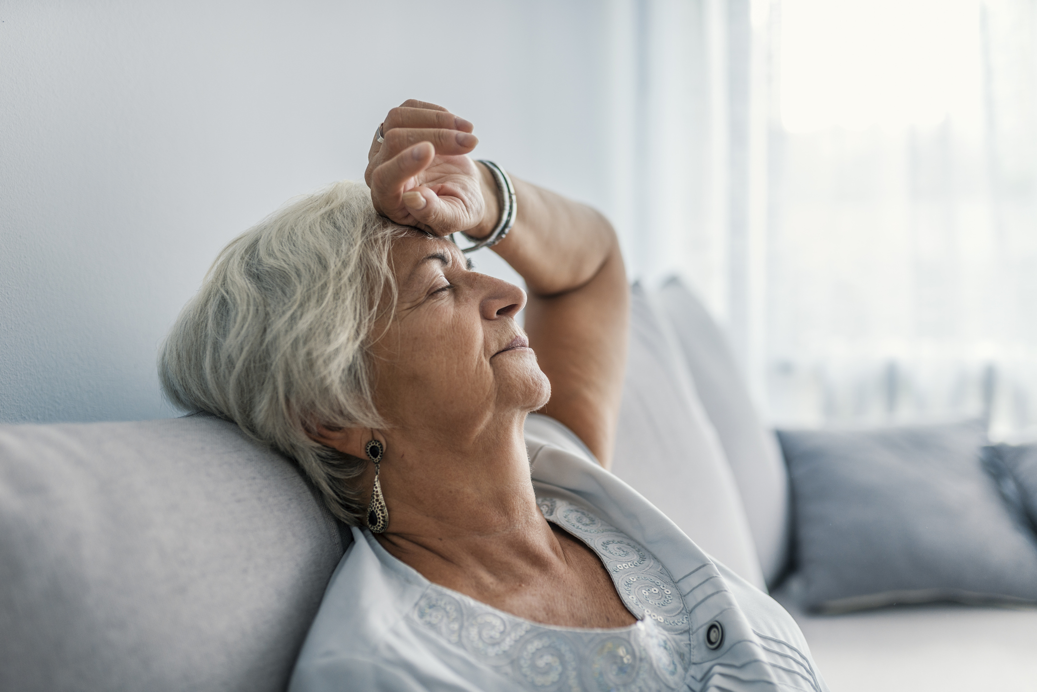 Elderly woman experiencing extreme fatigue.