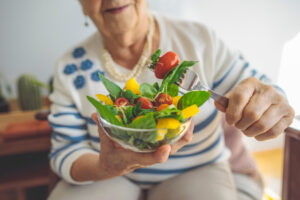 senior-lady-holding-salad